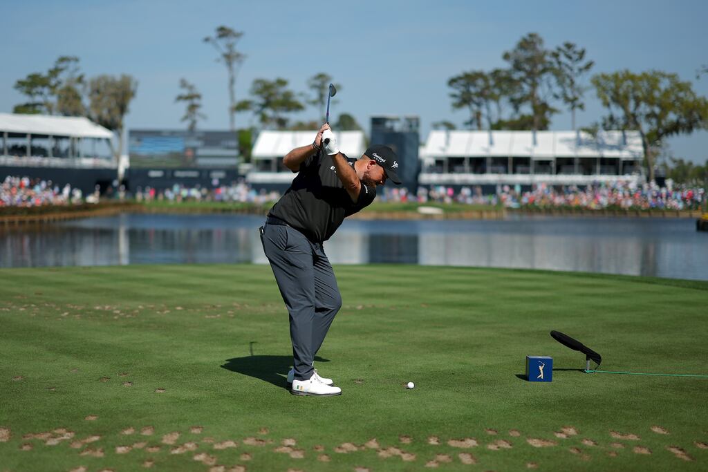 =Shane Lowry of Ireland plays his shot from the 17th tee during the Players Championship. Photograph: Kevin C Cox/Getty