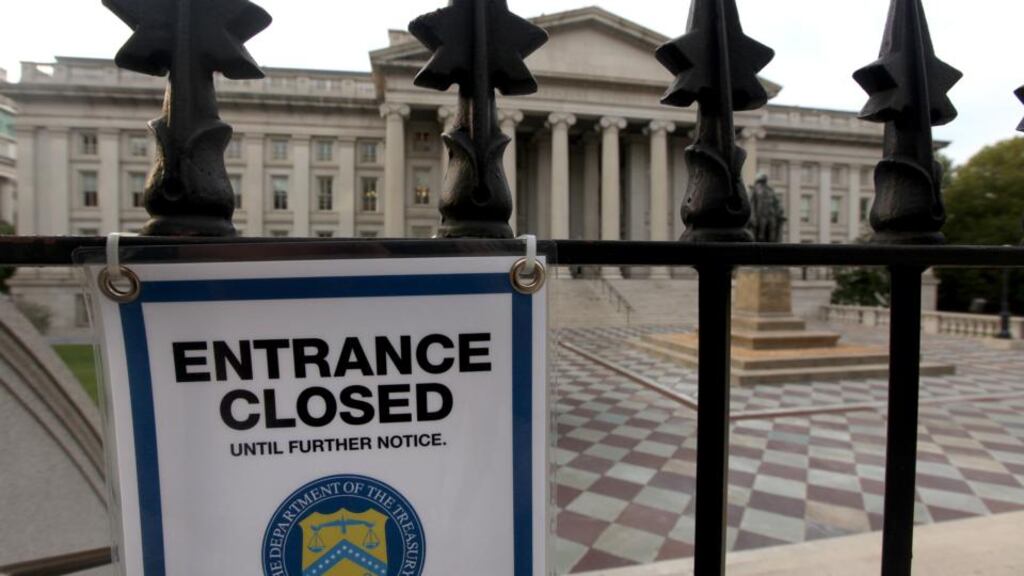 A closed sign hangs at the entrance to the US Treasury building in Washington DC. US House of Representatives Speaker John Boehner ruled out agreeing to a measure to raise the nation’s debt ceiling unless it includes conditions to rein in deficit spending. Photographer: Julia Schmalz/Bloomberg