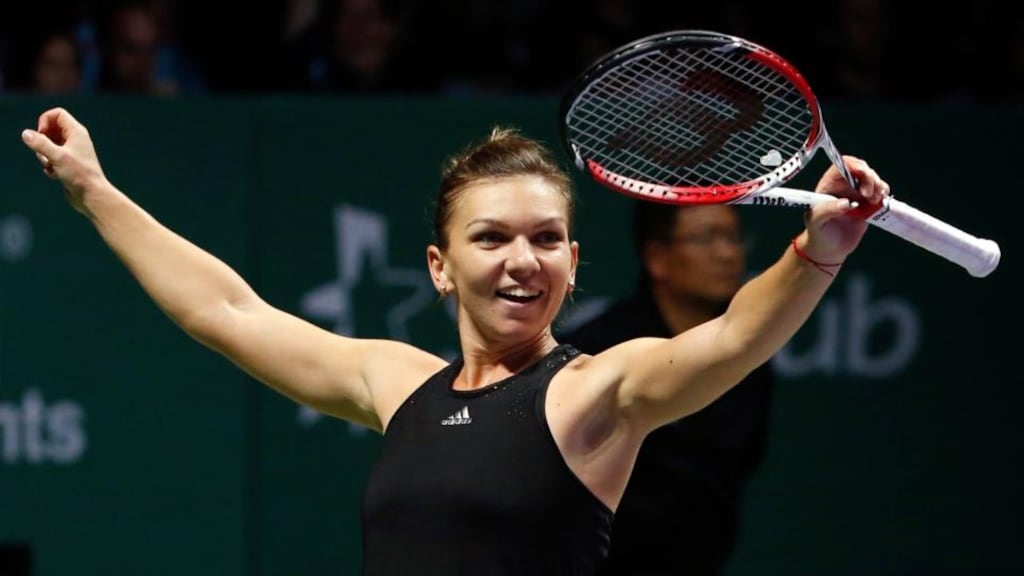 Simona Halep of Romania celebrates her win over Serena Williams during their WTA Finals match in Singapore. Photograph: Edgar Su/Reuters.