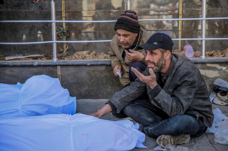 People mourning at Al-Shifa hospital in Gaza City, where health authorities said Israeli forces on Thursday shot dead more than 100 Palestinians as they waited for an aid delivery. Photograph: AFP via Getty Images