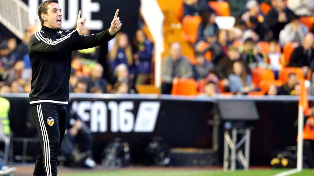 Valencia’s Gary Neville gives instructions to his players against Getafe FC during their Primera Division at the Mestalla. Photo: PA