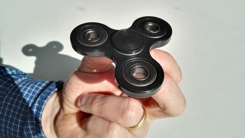 A fidget spinner close up. The toys come in hundreds of different guises and colours.
