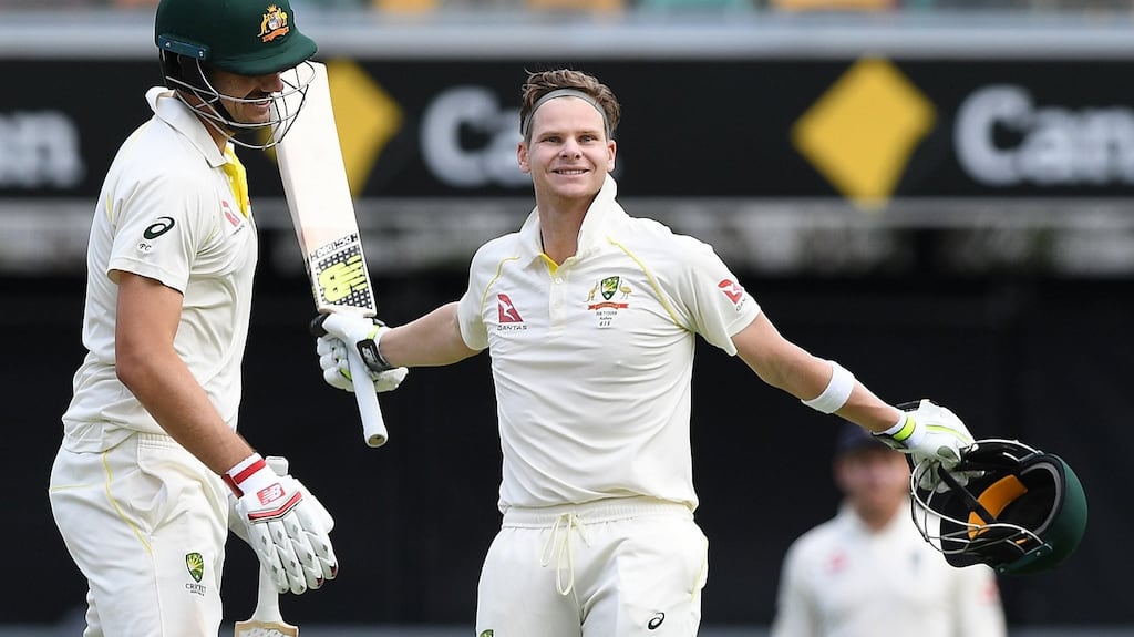 Steve Smith celebrates reaching his century at the Gabba. Photograph: Dave Hunt/EPA