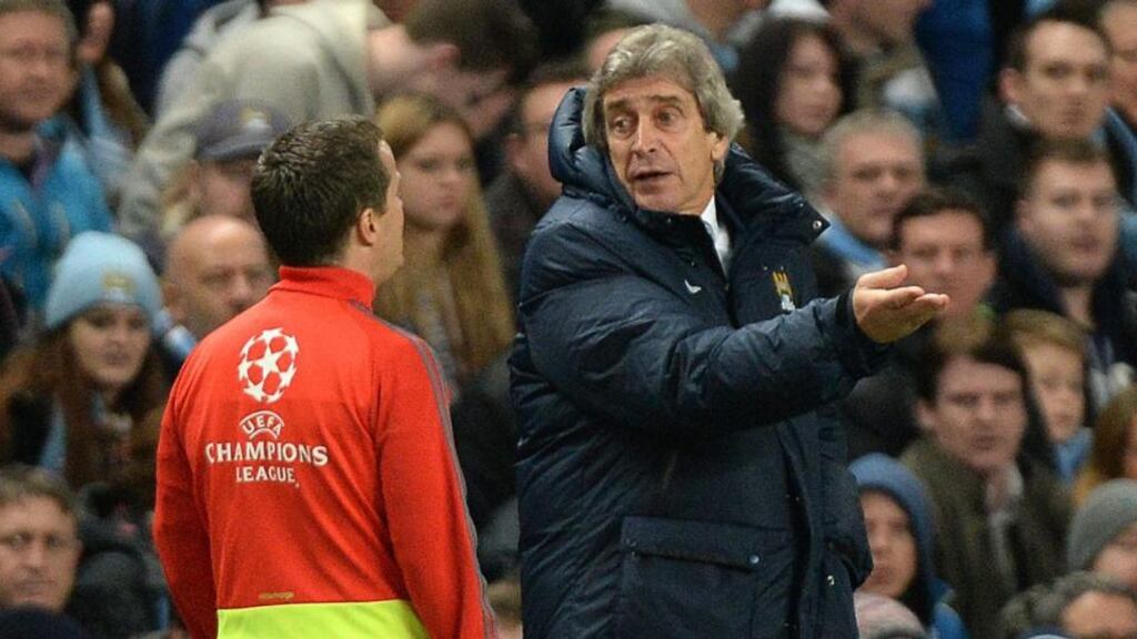 Manchester City manager Manuel Pellegrini (right) remonstrates with the fourth official during the Uefa Champions League round of sixteen first leg defeat to Barcelona. Photograph: Peter Powell/EPA