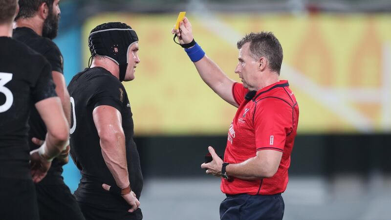 New Zealand’s Matt Todd is given a yellow card by referee Nigel Owens. Photograph: Billy Stickland/Inpho