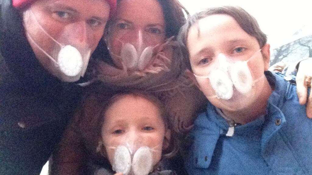 Clifford Coonan and his family have to wear masks to protect themselves during heavy smog in Beijing.