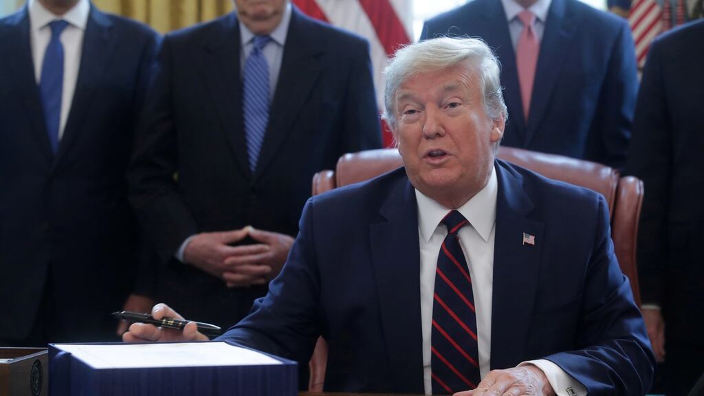Donald Trump at  a signing ceremony for the $2.2 trillion coronavirus aid bill at the White House last month. Photograph: Reuters/Jonathan Ernst