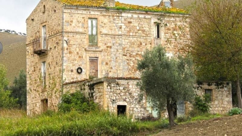 This stone building in Abruzzo, Italy, for €25,000 is divided into two three-storey homes that both need work
