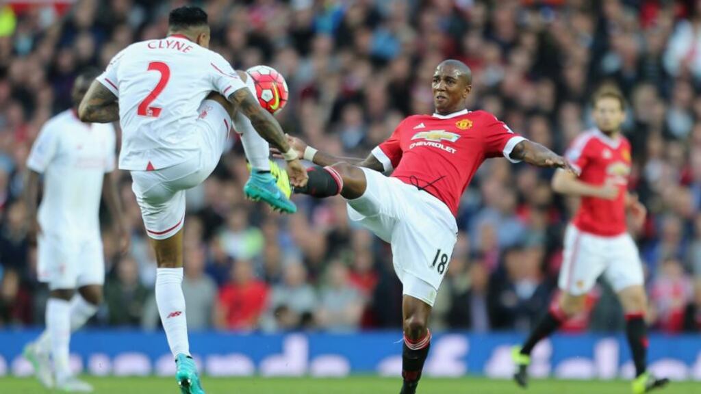 Manchester United’s Ashley Young in action with Nathaniel Clyne of Liverpool during the English Premier League game at Old Trafford on Saturday. Photograph: Getty.