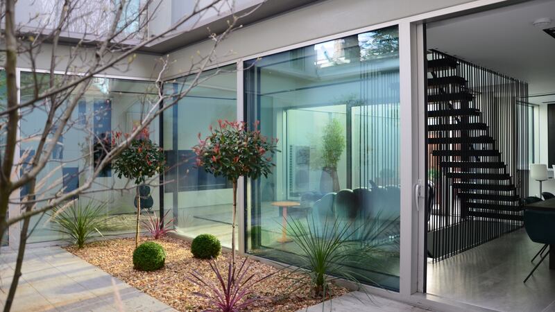 The addition of front and back courtyards give the mews an indoor-outdoor feeling.