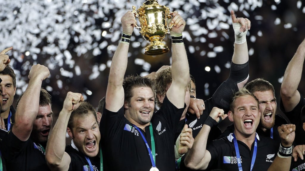 New Zealand captain Richie McCaw holding the Webb Ellis Cup in 2011. Photograph: Photosport