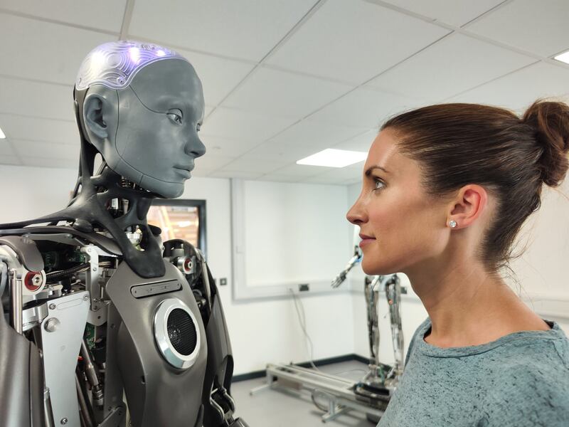 Anne-Marie Tomchak with Ameca, the world;'s most advanced human-like robot, in Game Changer: AI and You