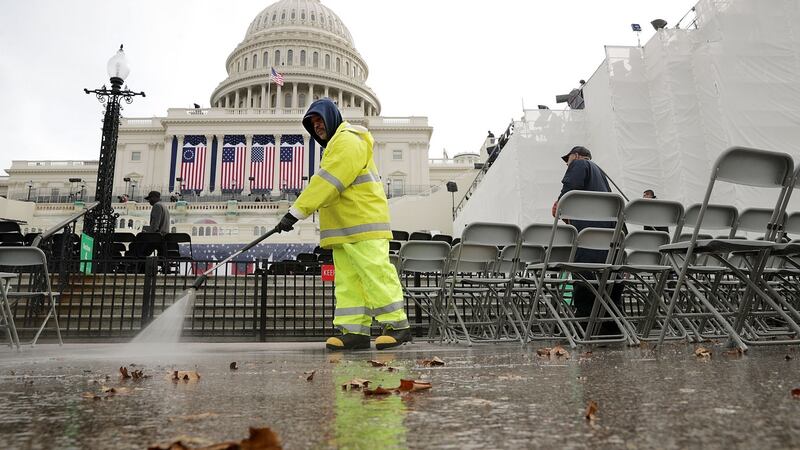 A worker uses a power washer to clean the West Front of the US Capitol a day before the inaguration as US president of Donald Trump in Washington, DC. Photograph: Chip Somodevilla/Getty Images