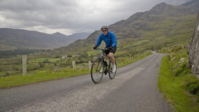 The cycle includes 1,350 metres of climbing over three of Ireland’s highest mountain passes. Photograph: Tadgh Hayes