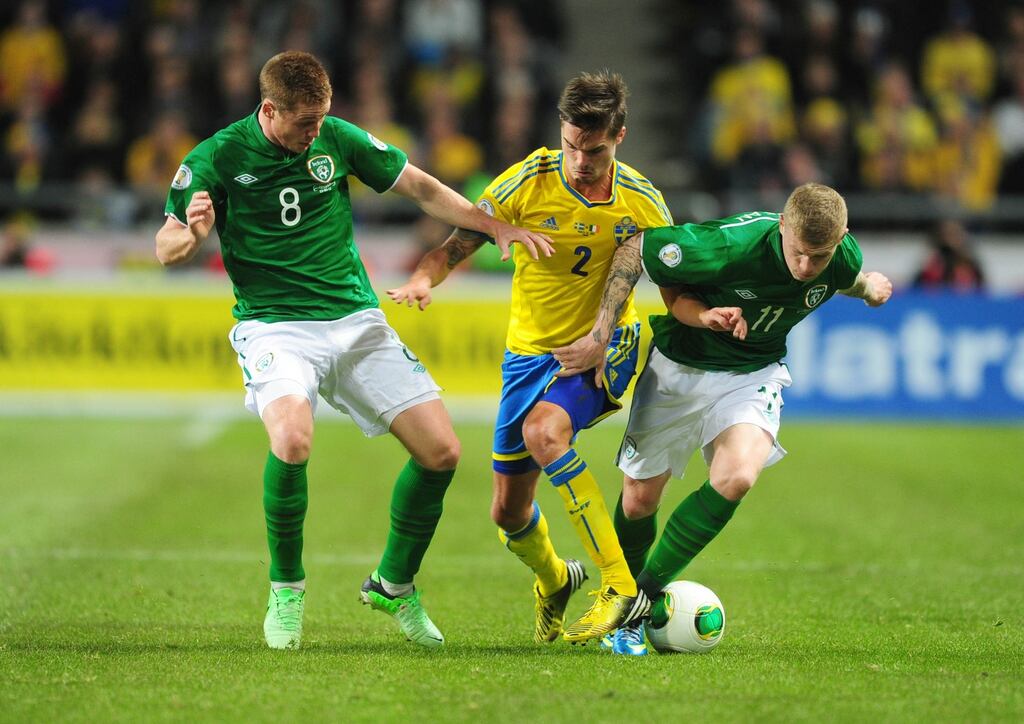 Sweden’s Mikael Lustig is stopped by Republic of Ireland’s James McCarthy and James McClean during last night’s game in Stockholm. Photograph: Adam Davy/PA