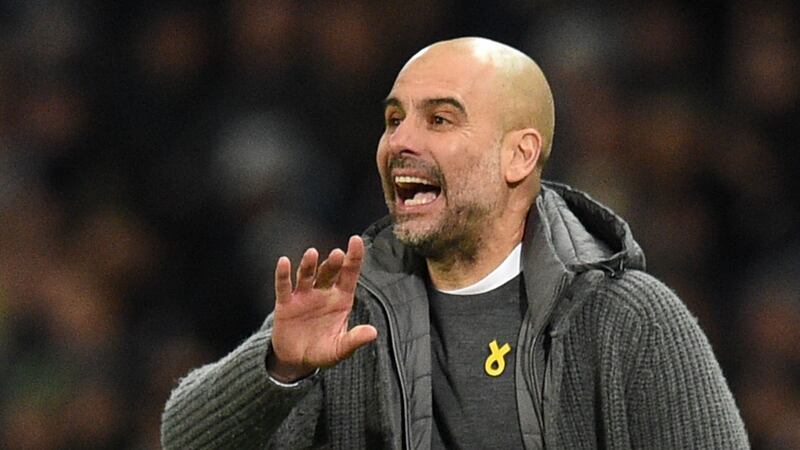 Manchester City’s Spanish manager Pep Guardiola gestures from the touchline wearing a yellow ribbon in support of Catalan prisoners during a game at the Etihad Stadium. Photograph: Oli Scarff/AFP/Getty