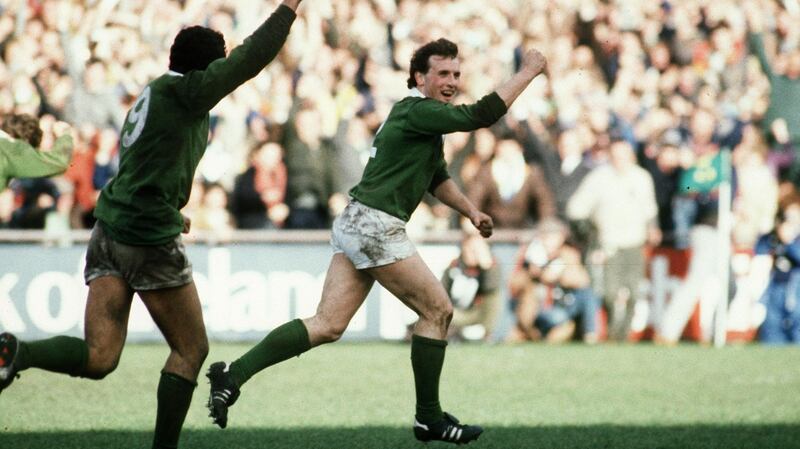 Michael Kiernan celebrates the drop goal that sealed victory over England and a Triple Crown for Ireland in 1985. Photograph: Billy Stickland/Inpho