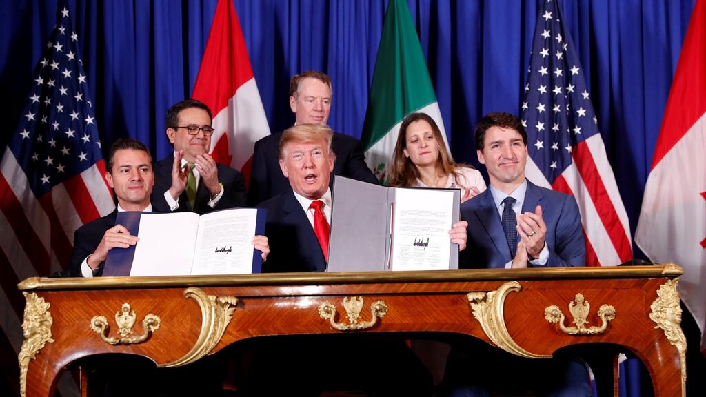 US president Donald Trump,  with Canada’s prime minister Justin Trudeau (right)  and Mexico’s president Enrique Pena Nieto at the USMCA signing ceremony before the G20 summit in Buenos Aires. Photograph: Kevin Lamarque