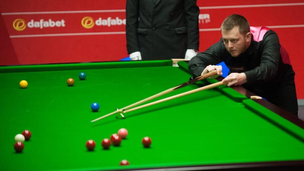 Mark  Allen in action against Michael Holt during the Dafabet World Snooker Championships at The Crucible, Sheffield. Photograph: Tim Goode/PA Wire