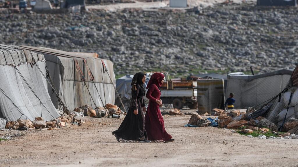 Displaced Syrian women at a camp in Kafr Lusin village on the border with Turkey in Syria’s northwestern province of Idlib. Photograph: Ozan Kose/AFP via Getty