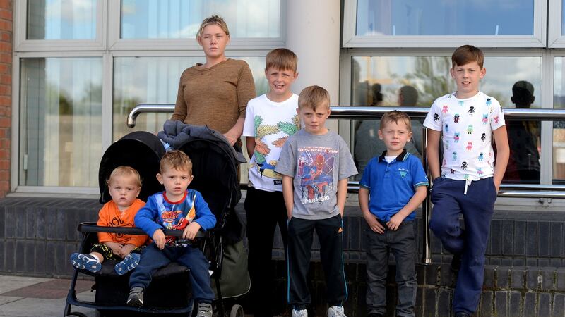 Margaret Cash with her children Johnny, Thomas, Michael, Andy, Jim and Miley outside the Council Offices in Tallaght. Photograph: Cyril Byrne/The Irish Times.