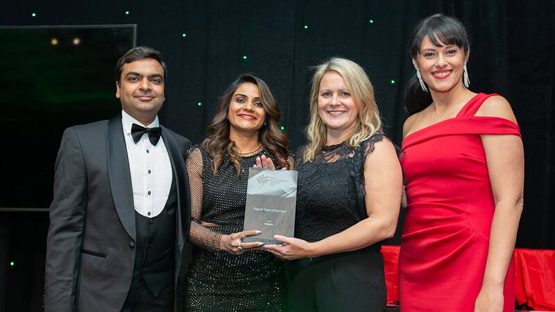 Rohit Garg and Geetika Garg, directors, Axon Outsourcing, presents the Payroll Team of the Year award to Sinead Doherty and Debie McGill, Fenero.