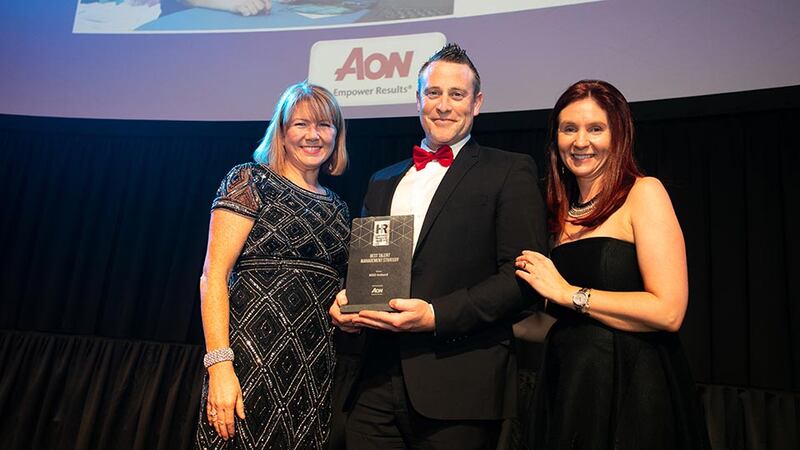 Brian McKiernan, Sales & Business Development Manager, Aon, presents the Best Talent Management Strategy award to Lorraine Kenny & Louise Roberts, MSD Ireland.