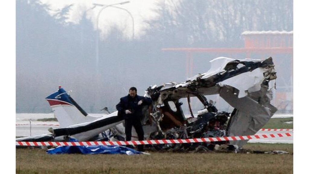 A police photographer inspects the scene of a tourist plane crash at Charleroi airport. Photograph: Sebastien Pirlet/Reuters