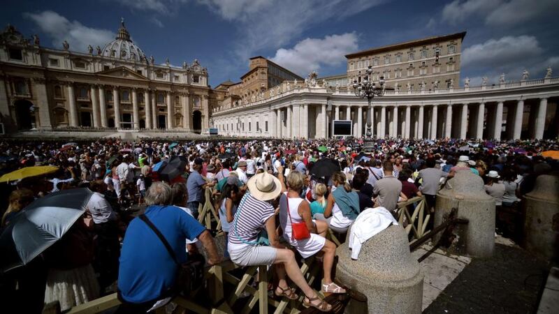 Crowds gather in St Peter’s Square at the Vatican to follow Pope Francis sunday Angelus prayer from the window of his study overlooking the square on September 6, 2015. Photograph: Filippo Monteforte/Getty Images