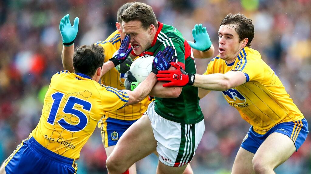 Roscommon’s Niall Kilroy, Fintan Cregg and David Murray with Andy Moran of Mayo during  Sunday’s All-Ireland Championship quarter-final. Photograph: INPHO/James Crombie