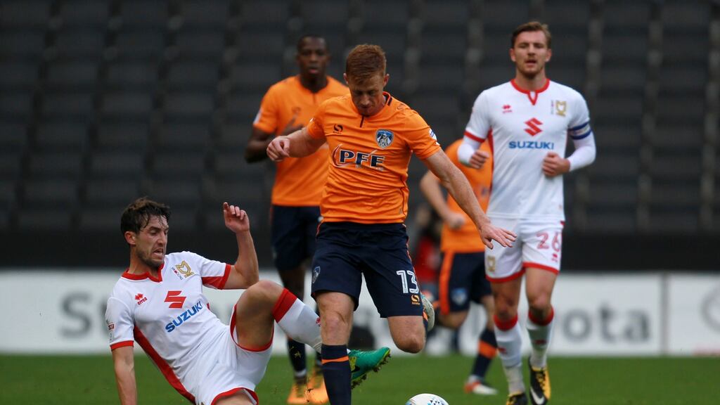 Eoin Doyle skips past a tackle from MK Dons’ Joe Walsh during their recent League One clash. Photo: Harry Hubbard/Getty Images