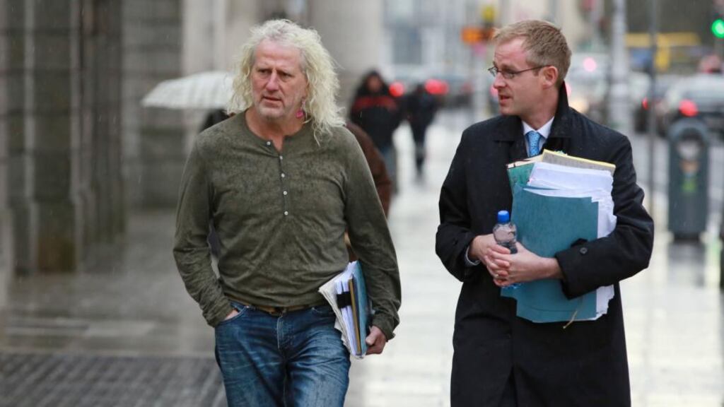Mick Wallace arriving at the Four Courts today with his solicitor  Gareth Noble. Photograph: Collins Courts