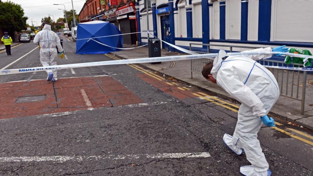 Garda forensic team members examine the Hanlon’s Corner area following a shooting in which four people were injured early this morning. Photograph: Eric Luke/The Irish Times