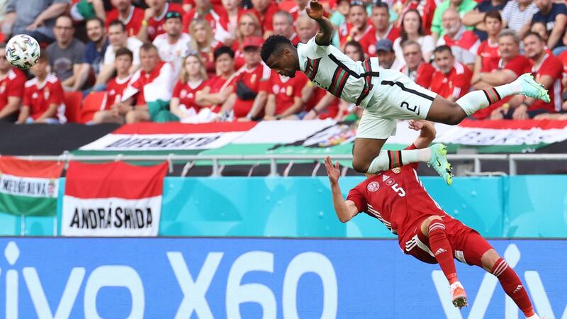 Portugal’s Nelson Semedo climbs above Hungary’s Attila Fiola during his side’s 3-0 win in Budapest. Photograph: Bernadett Szabo/Getty/AFP
