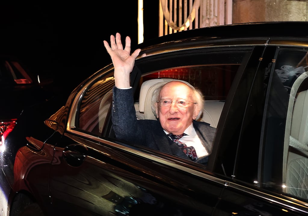 President Michael D Higgins waves to the crowd whilst leaving Áras an Uachtaráin with his wife Sabina Higgins. A guard of honour was formed outside the gates of the official residence by the Sanctuary Runners. Photograph: Damien Eagers/ PA
