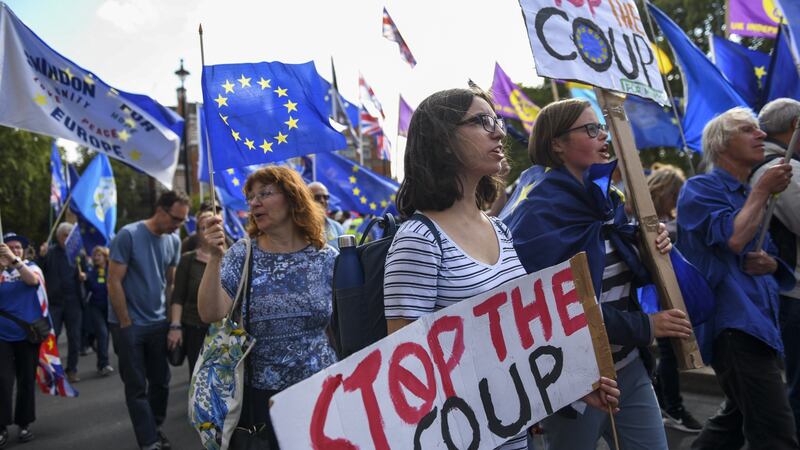 Anti-Brexit protesters carry ‘Stop The Coup’ banners near parliament in London. Photograph: Chris J Ratcliffe/Bloomberg