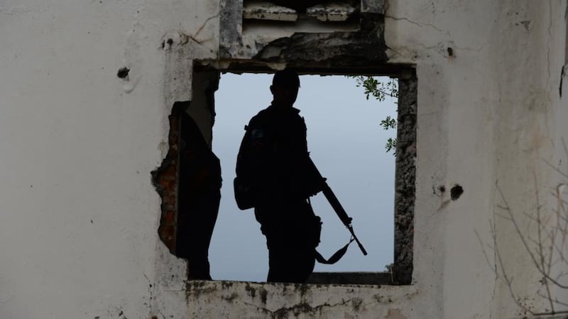 Gang war: police search a drug-gang hideout in Baixada Fluminense in 2013. Photograph: Vanderlei Almeida/AFP/Getty