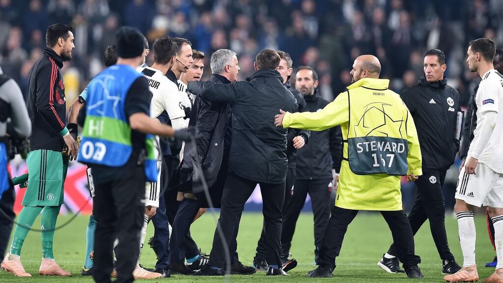 Manchester United’s José Mourinho is escorted off the pitch following his side’s Champions League win over Juventus. Photo: Alessandro Di Marco/EPA