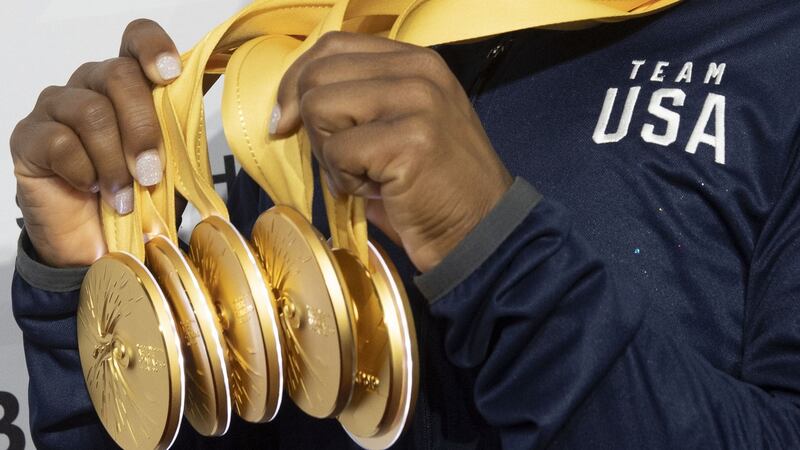 Simone Biles poses after the apparatus finals with the five gold medals she won at the FIG Artistic Gymnastics World Championships at the Hanns-Martin-Schleyer-Halle in Stuttgart. Photograph: Thomas Kienzle/AFP via Getty Images