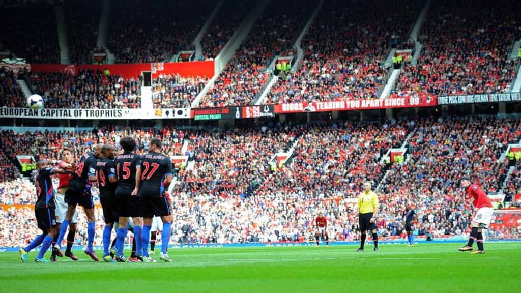 Wayne Rooney fires home a free-kick to score Manchester United’s second goal in the Premier League victory over Crystal Palace at Old Trafford. Photograph: Martin Rickett/PA