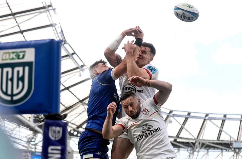 Dan Sheehan competes for a high ball with Jacob Stockdale and John Cooney. Photograph: Dan Sheridan/Inpho