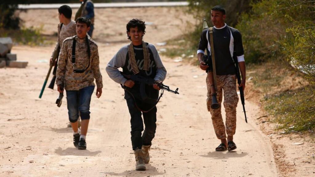 Fighters from Misrata move towards positions of Islamic State militants near Sirte. Photograph: Goran Tomasevic/Reuters