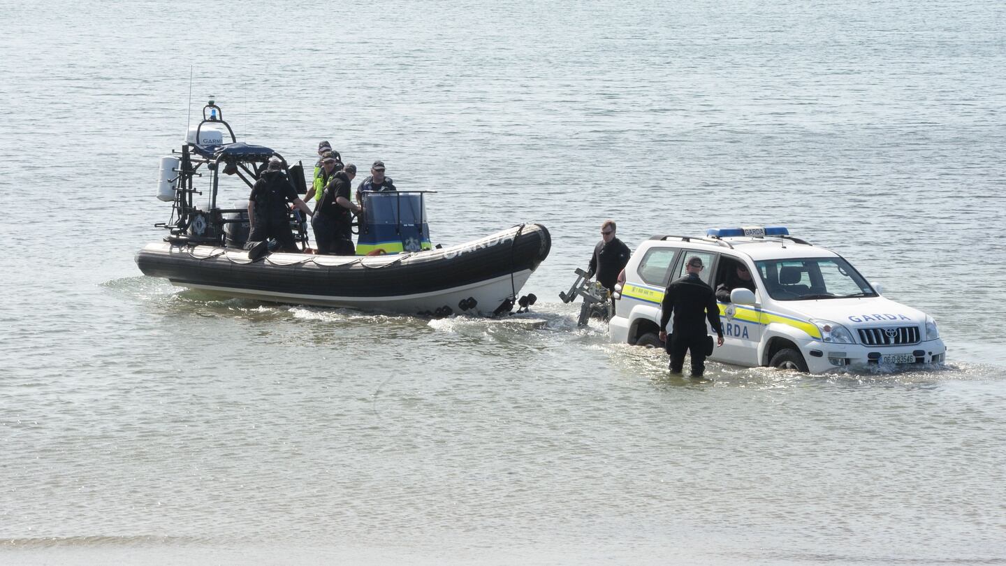 Members of the Garda Under Water Unit on their way to search at Skerries harbour. Photograph: Alan Betson / The Irish Times