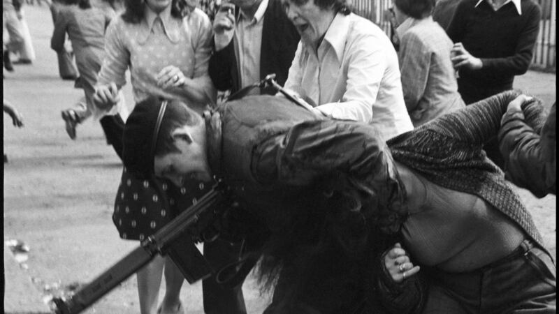 A British soldier restrains a woman during protests in the Ardoyne district of north Belfast in 1976. Photograph: Alex Bowie/ Getty Images