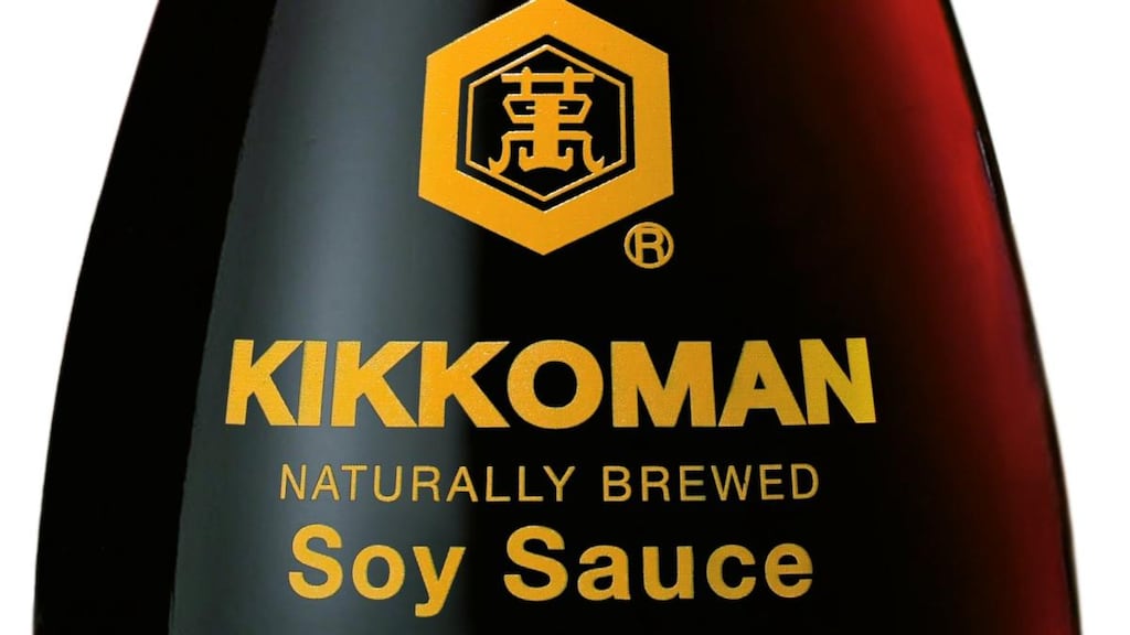 Kikkoman soy sauce bottle has a heavy base for stability, unobtrusive lettering and a delicate neck topped with a red plastic cap