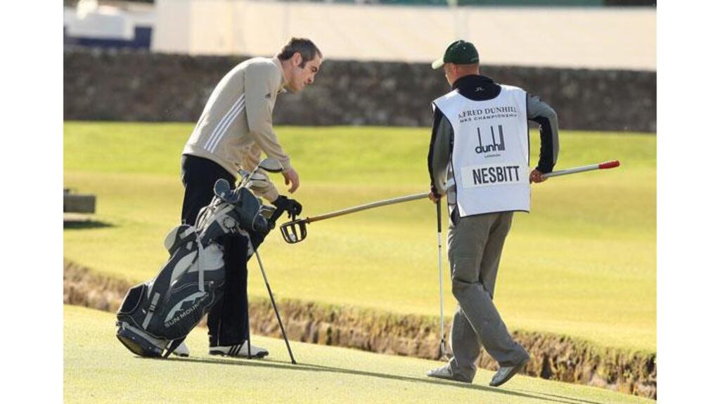 Irish actor Jimmy Nesbitt retrieves his ball from the Swilken Burn on the first hole at St Andrews. Photograph: David Cheskin/PA Wire