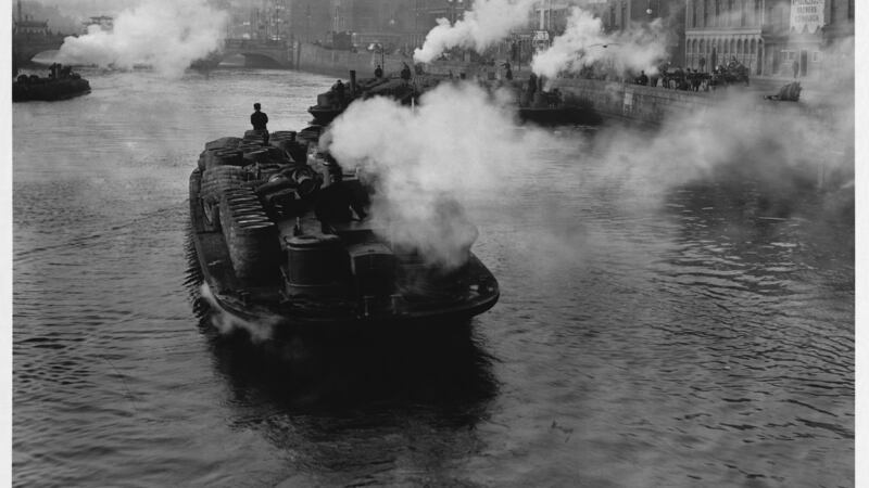 A barge transporting goods on the River Liffey. Photograph: © Hulton-Deutsch Collection/Corbis via Getty Images