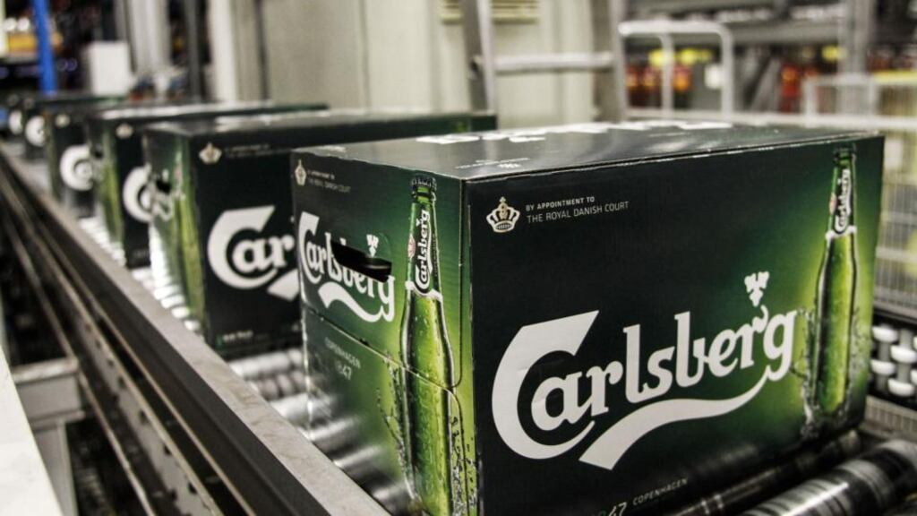 Boxes of Carlsberg bottled beer move along a conveyor belt  at the Carlsberg  distribution depot in Tastrup, Denmark. Photo: Bloomberg