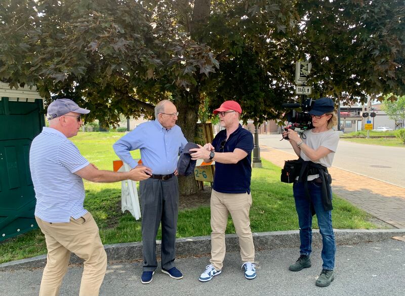 George Mitchell with film-maker Trevor Birney (centre) and film crew in Waterville, Maine