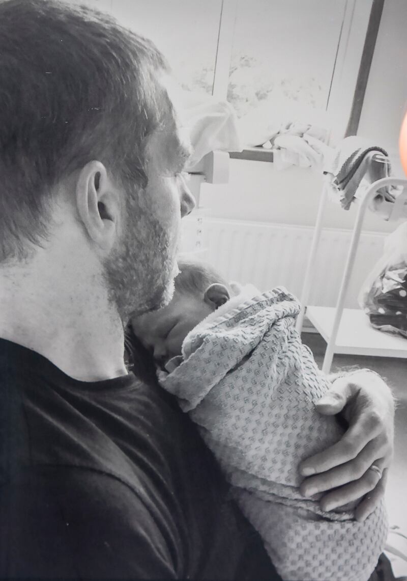 Rob Cashin being held by his father shortly after his birth. Photograph: Colin Keegan/Collins Dublin